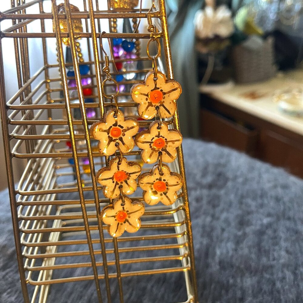 White and gold ceramic floral hanging earrings